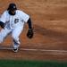 Tigers' first baseman Prince Fielder misses chases down a ball that slipped past him during Game 4 of the ALCS against the Yankees at Comerica Park in Detroit on Thursday. 
